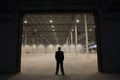 Businessman Standing At Warehouse Entrance