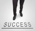 Businessman standing wearing court shoes on success line. Royalty Free Stock Photo