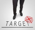 Businessman standing wearing court shoes on target(aim) line. Royalty Free Stock Photo