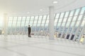 Businessman standing in the white great hall of the business center, and looks towards the city Royalty Free Stock Photo