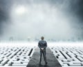 Businessman standing on white labyrinth