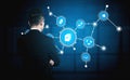 Businessman Analyzing Digital Network Connections with Icons Representing Data Flow and Technology on a Futuristic Royalty Free Stock Photo