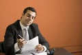 Businessman Stapling Papers - Horizontal Royalty Free Stock Photo