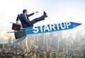 Businessman in start-up concept flying on rocket Royalty Free Stock Photo
