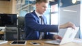 Businessman Starting his Working Day, Opening Laptop