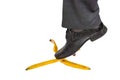 Businessman stepping on banana peel - business risk concept Royalty Free Stock Photo