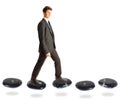 Businessman On Stepping Stones Royalty Free Stock Photo