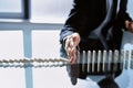 businessman stopping dominoes with his hand. close-up. Royalty Free Stock Photo