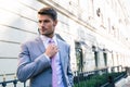 Businessman straightens his tie