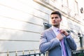 Businessman straightens his tie