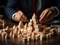Businessman strategically assembling wooden blocks