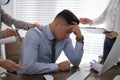 Businessman stressing out at workplace in office