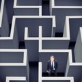 Businessman Stuck In A Maze Royalty Free Stock Photo