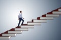 The businessman student climbing the ladder of education books Royalty Free Stock Photo