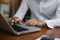 Businessman or student using laptop at home, Man hands typing on computer keyboard closeup, online learning, internet marketing