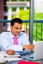 Businessman or student working laptop and writing Royalty Free Stock Photo