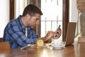 Businessman or student working with laptop computer at coffee shop having breakfast Royalty Free Stock Photo