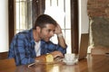 Businessman or student working with laptop computer at coffee shop having breakfast Royalty Free Stock Photo