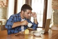 Businessman or student working with laptop computer at coffee shop having breakfast Royalty Free Stock Photo