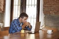 Businessman or student working with laptop computer at coffee shop having breakfast Royalty Free Stock Photo