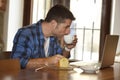 Businessman or student working with laptop computer at coffee shop having breakfast Royalty Free Stock Photo