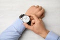 Businessman with stylish wrist watch at table Royalty Free Stock Photo