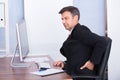 Businessman suffering from back pain