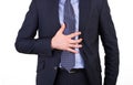 Businessman suffering from heartburn. Royalty Free Stock Photo