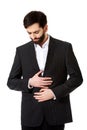 Businessman suffering from stomach pain. Royalty Free Stock Photo