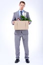 Businessman, suit and box for resignation, fired or transfer at company for liquidation on white backdrop. Employee Royalty Free Stock Photo