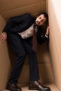 Businessman with claustrophobia inside a box Royalty Free Stock Photo