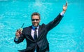 Businessman in suit drink cocktail in pool. Businessman celebrate successful deal. Successful project. Businessman in Royalty Free Stock Photo