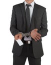 Businessman in suit and handcuffs handing over card Royalty Free Stock Photo