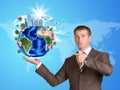 Businessman in a suit hold Earth with buildings Royalty Free Stock Photo