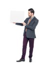 businessman in suit holding blank placard Royalty Free Stock Photo