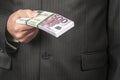 Businessman with a bundle of euro money Royalty Free Stock Photo