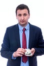 Businessman in suit holding dollar bundle in hands isolated on white Royalty Free Stock Photo
