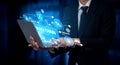 Businessman in Suit Holding Laptop with Blockchain Graphics and Digital Connections in Modern Technology Concept for Royalty Free Stock Photo