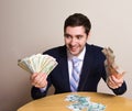 Businessman in suit holding money in his hands dollar and ruble banknote, crazy look