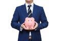 Businessman in suit is holding piggy bank. Businessman holding pig money box. Finance Savings concept