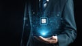 Businessman in Suit Holding Smartphone with Digital Circuit and Chip Technology Concept Representing Future Innovation Royalty Free Stock Photo