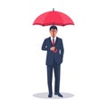 Businessman in suit holding umbrella in hand