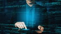Businessman in Suit Interacting with Digital Coding Interface While Programming on Tablet with Blue Glowing Text and Royalty Free Stock Photo
