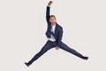 A businessman in a suit jumps for joy. Royalty Free Stock Photo