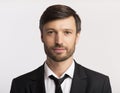 Businessman In Suit Looking At Camera Over White Background, 