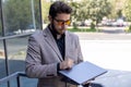 Businessman in suit making notes on a clipboard Royalty Free Stock Photo