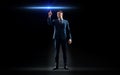 Businessman in suit pointing finger to laser light