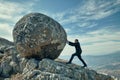 a businessman in a suit is pushing a huge boulder uphill with tension Royalty Free Stock Photo