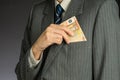 Businessman hand holding money, euro bills. Banknotes isolated gray background. Royalty Free Stock Photo