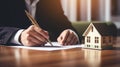 Businessman in a suit signing a home loan contract. AI Generated